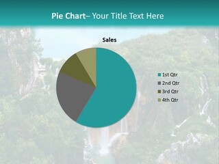 A Waterfall In The Middle Of A Lake Surrounded By Trees PowerPoint Template