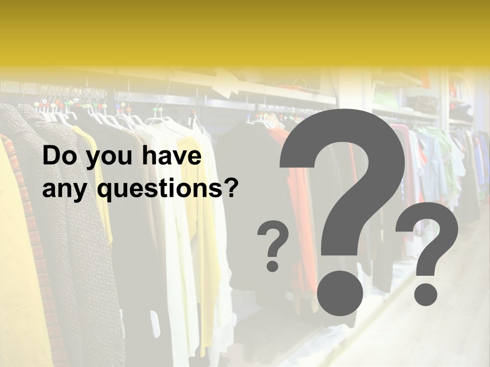 A Bunch Of Clothes Hanging On A Rack In A Store PowerPoint Template