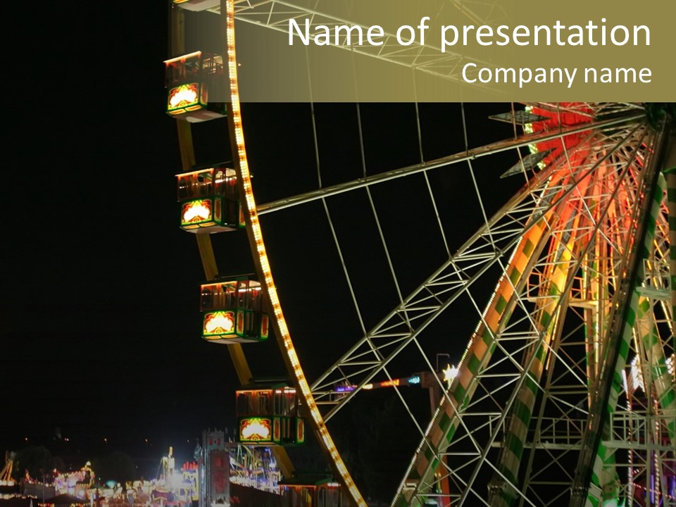 A Ferris Wheel Is Lit Up At Night PowerPoint Template