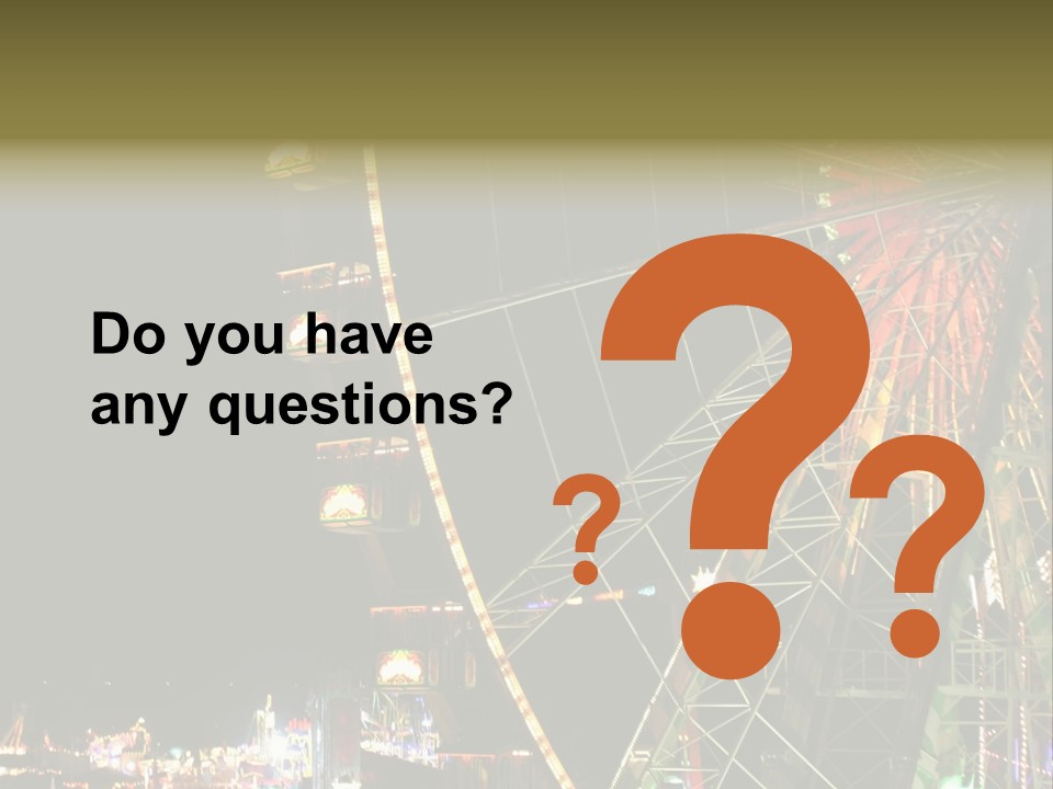 A Ferris Wheel Is Lit Up At Night PowerPoint Template