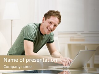 Man Sitting On Sofa In Livingroom Typing On Laptop PowerPoint Template