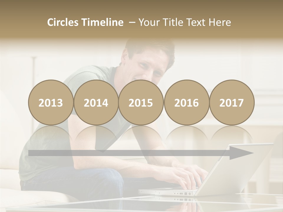 Man Sitting On Sofa In Livingroom Typing On Laptop PowerPoint Template