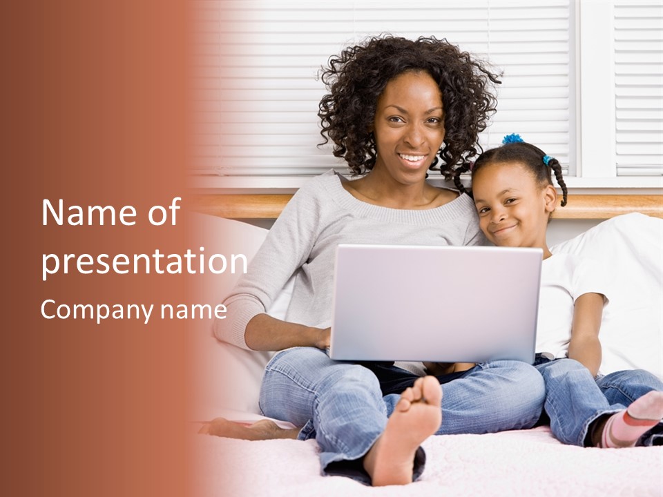 A Woman And Child Sitting On A Bed With A Laptop PowerPoint Template