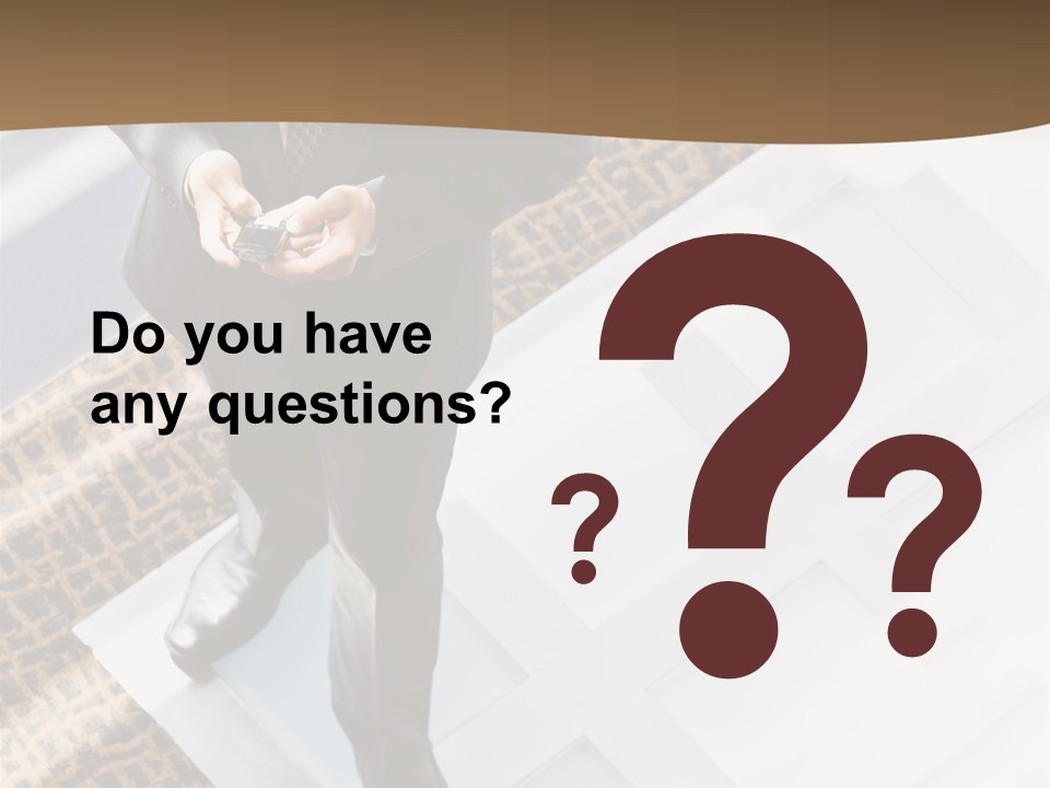 A Man In A Suit Is Looking Down At His Cell Phone PowerPoint Template