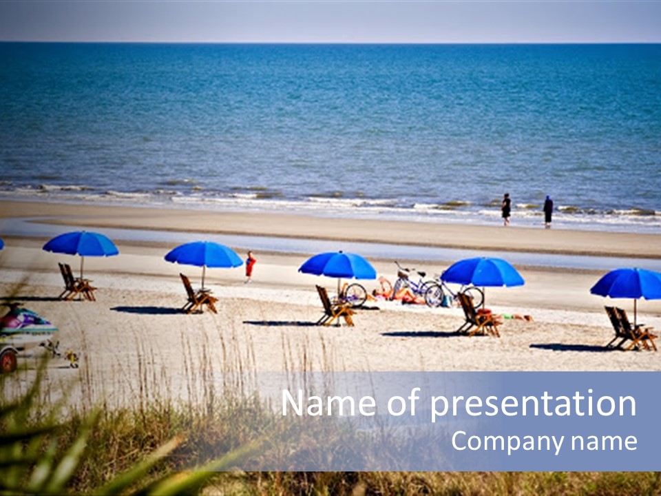 A Group Of Beach Chairs And Umbrellas On The Beach PowerPoint Template