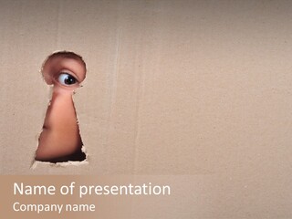 Eye Looking Through A Conceptual Keyhole On Cardboard, Close Up PowerPoint Template