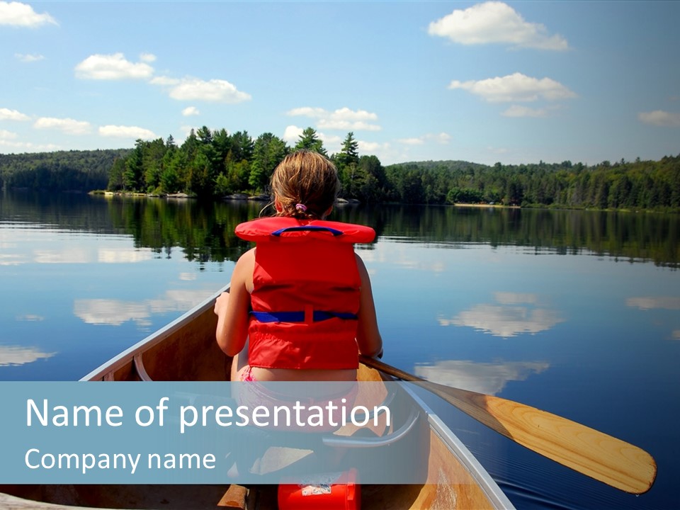 Young Girl In Canoe Paddling On A Scenic Lake PowerPoint Template