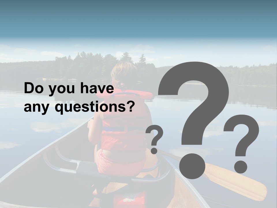 Young Girl In Canoe Paddling On A Scenic Lake PowerPoint Template