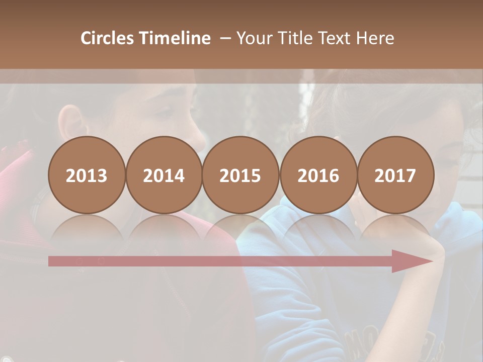 Two Young Girls Sitting On A Bench Looking At Something PowerPoint Template