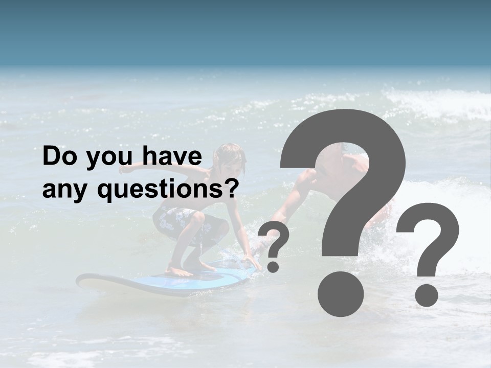 Father Teaching His Young Son How To Surf In The Sea On Vacation Or Holiday PowerPoint Template