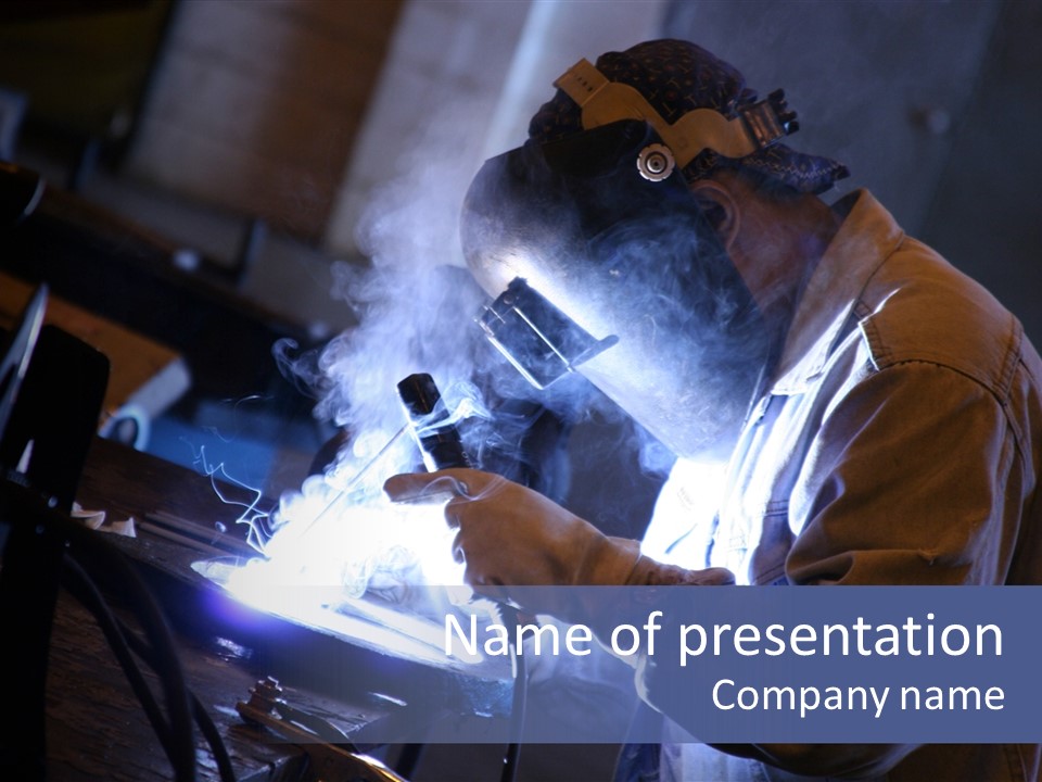 Arc Welder At Work At His Workbench PowerPoint Template