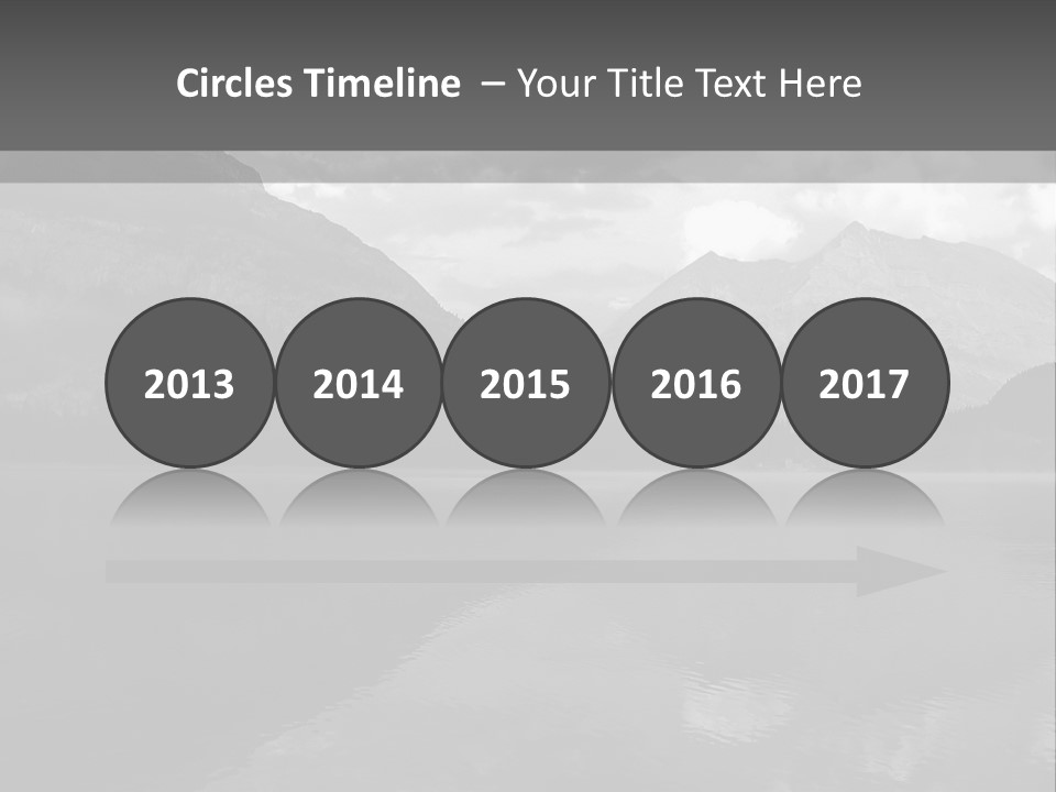 A Black And White Photo Of A Lake With Mountains In The Background PowerPoint Template