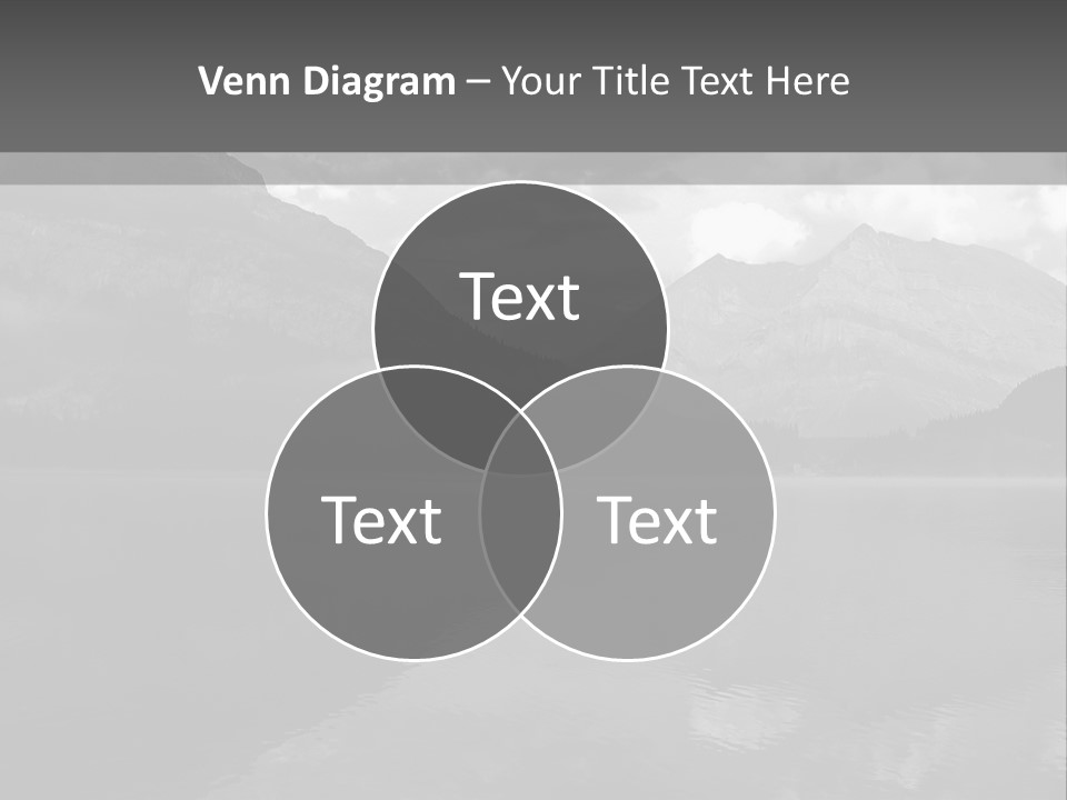 A Black And White Photo Of A Lake With Mountains In The Background PowerPoint Template