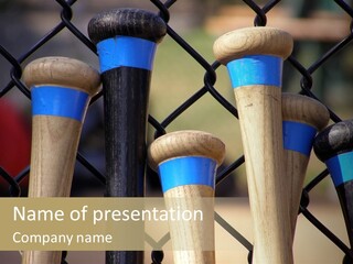 Baseball Bats Leaning Against A Batting Cage Fence. PowerPoint Template