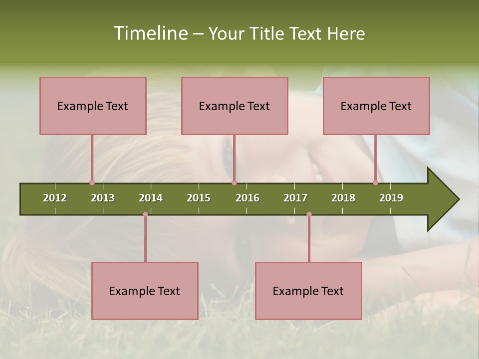 Six Year Old Boy Lying Down In The Grass. PowerPoint Template