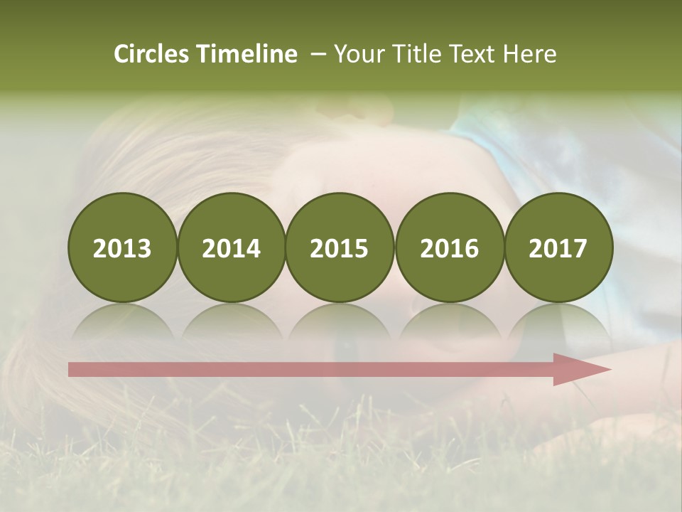 Six Year Old Boy Lying Down In The Grass. PowerPoint Template