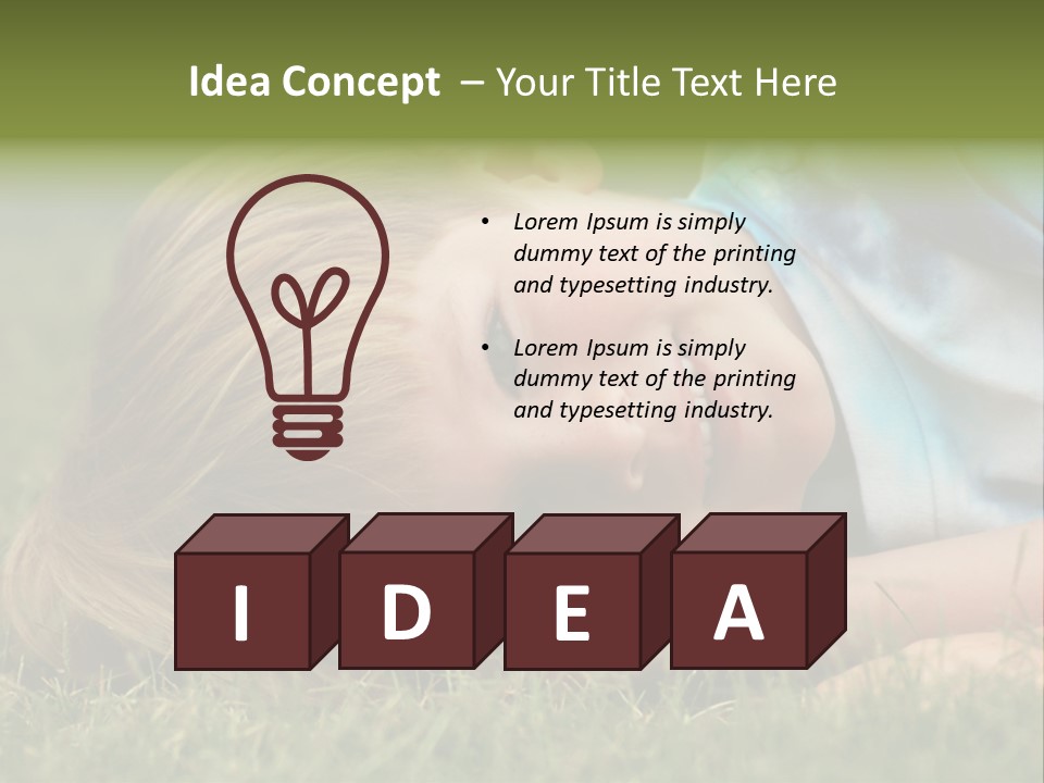 Six Year Old Boy Lying Down In The Grass. PowerPoint Template