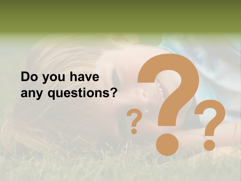Six Year Old Boy Lying Down In The Grass. PowerPoint Template