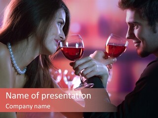 Young Couple Sharing A Glass Of Red Wine In Restaurant, Celebrating Or On Romantic Date PowerPoint Template