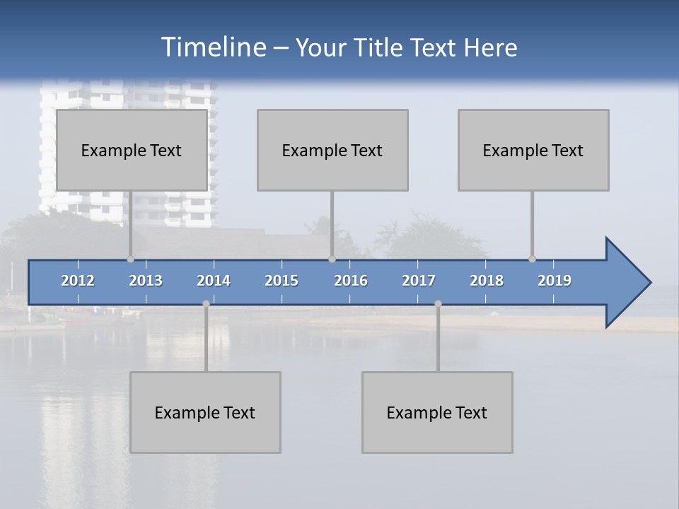 A Large White Building Sitting Next To A Body Of Water PowerPoint Template