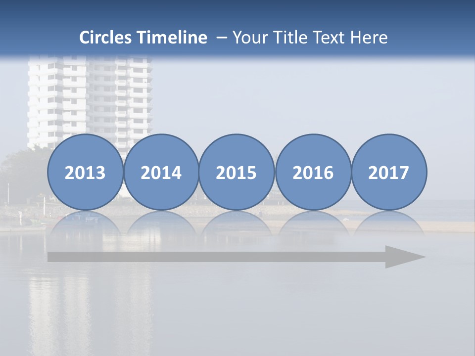 A Large White Building Sitting Next To A Body Of Water PowerPoint Template