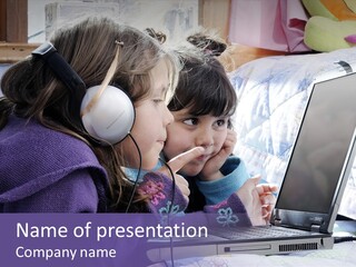 Two Small Girls, One With Laptop And Headphones Pointing At The Screen And The Other Watching It PowerPoint Template