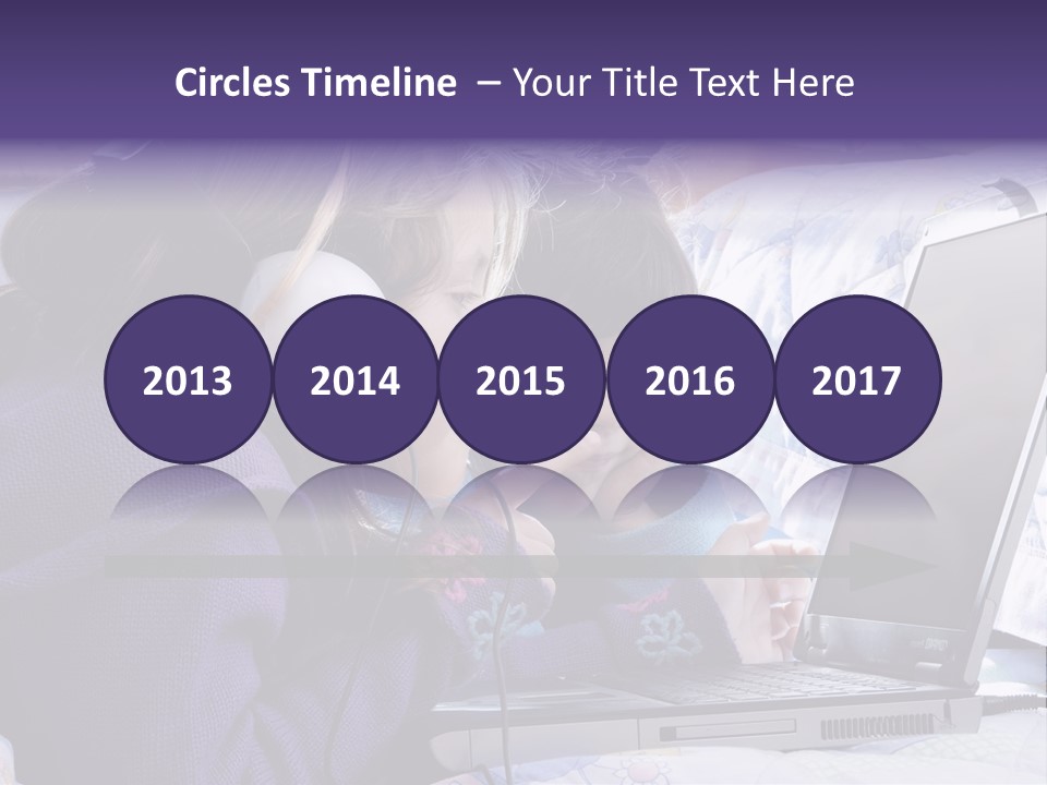 Two Small Girls, One With Laptop And Headphones Pointing At The Screen And The Other Watching It PowerPoint Template