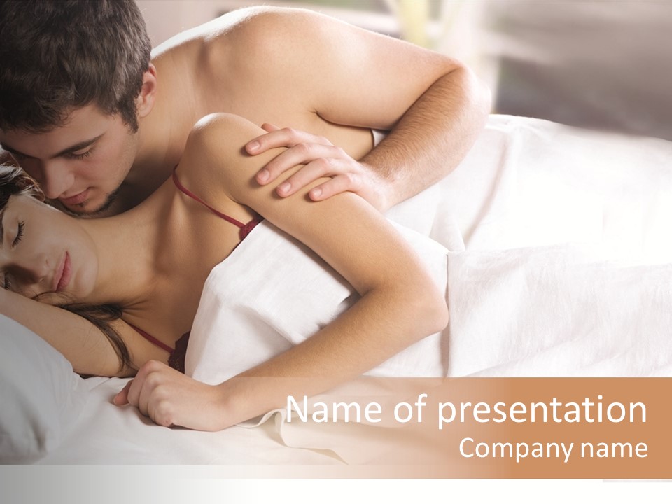 Young Couple Kissing And Hugging On The Bed In Bedroom PowerPoint Template