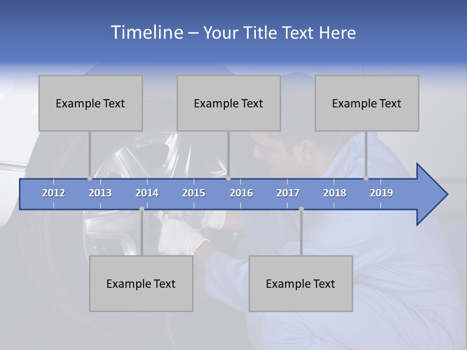 Auto Mechanic Removing Wheel Of A Car In A Workshop PowerPoint Template