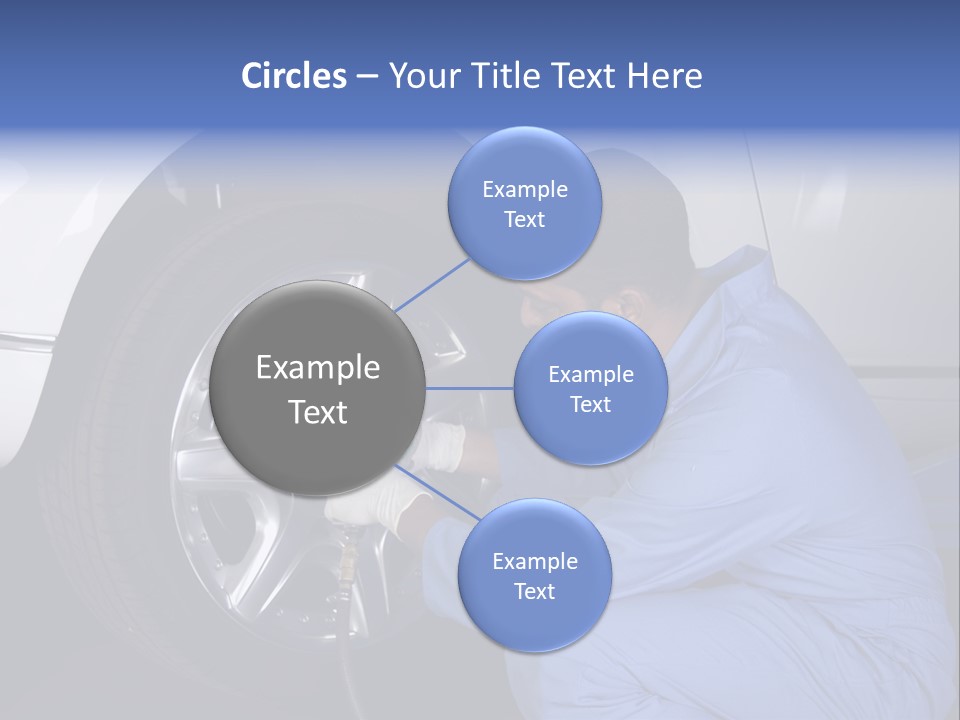 Auto Mechanic Removing Wheel Of A Car In A Workshop PowerPoint Template