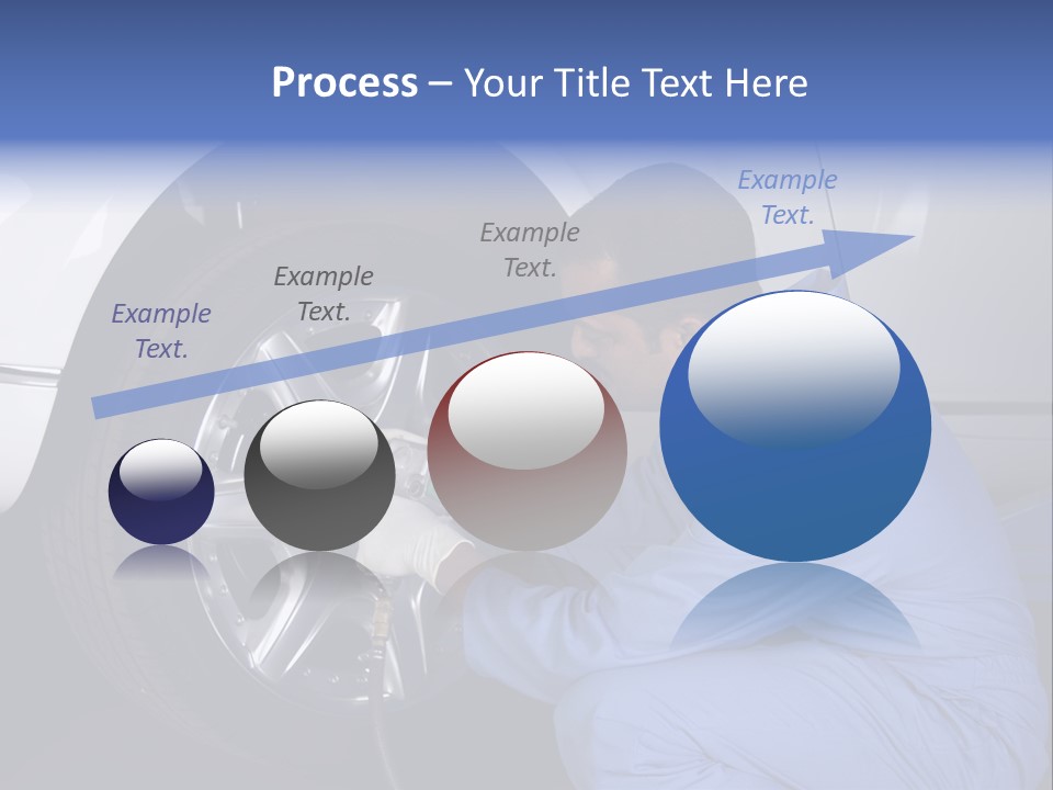 Auto Mechanic Removing Wheel Of A Car In A Workshop PowerPoint Template