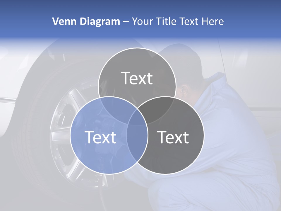 Auto Mechanic Removing Wheel Of A Car In A Workshop PowerPoint Template