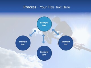 A Mountainbiker Flys Across The Sky During A Freeriding Contest Held In Whistler, Bc. PowerPoint Template