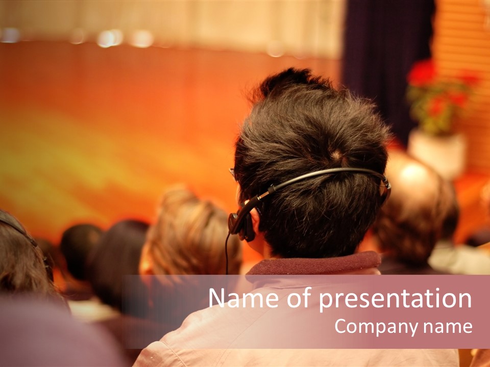 The Audience Wearing Head Phone For Online Translation PowerPoint Template