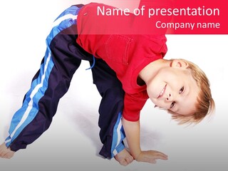 A Cute Four Year Old Boy Wearing Red And Blue Bending Over To Touch His Right Toes. PowerPoint Template