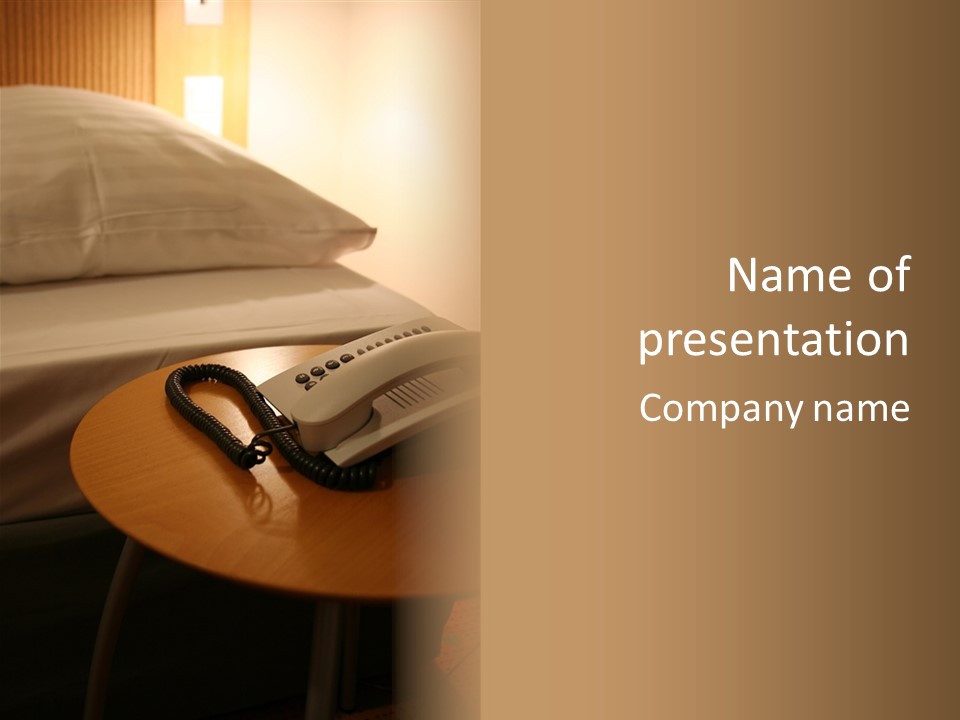 A Phone On A Table Next To A Bed PowerPoint Template