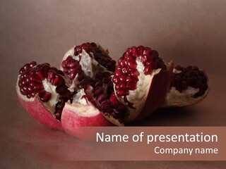 Gorgeous Broken Pomegranate In Holland's Style Laying On The Craft Paper PowerPoint Template