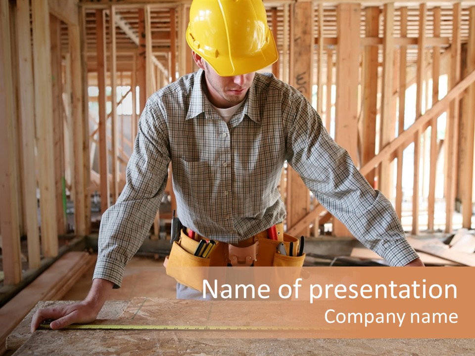 A Man Working Building A Home And Measuring Some Wood PowerPoint Template