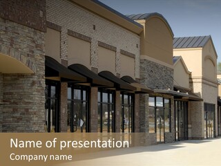 A Row Of Storefronts On A Brick Building PowerPoint Template