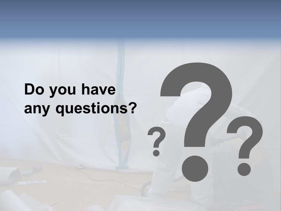 A Man In White Coveralls Painting A Wall PowerPoint Template
