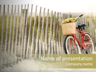 Red Vintage Bicycle With Basket And Flowers Leaning Against Wooden Fence At Beach. PowerPoint Template