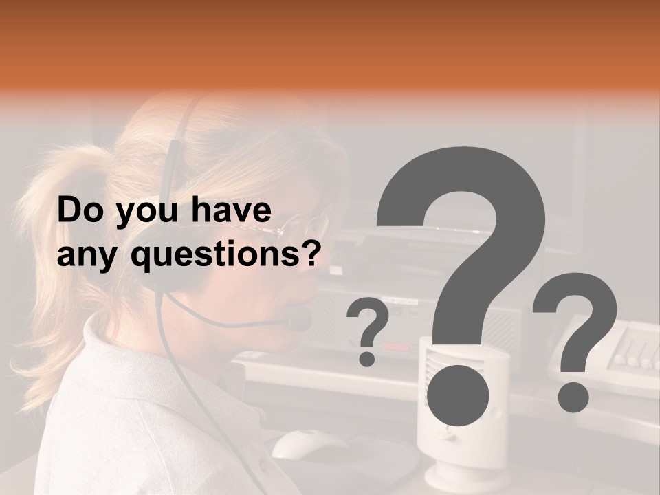 A Woman With A Headset Is Sitting In Front Of A Computer PowerPoint Template