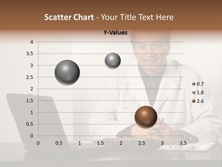 Asian American Male Doctor Sitting At Desk With Charts And Laptop Computer Looking At Viewer. PowerPoint Template