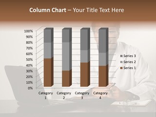 Asian American Male Doctor Sitting At Desk With Charts And Laptop Computer Looking At Viewer. PowerPoint Template