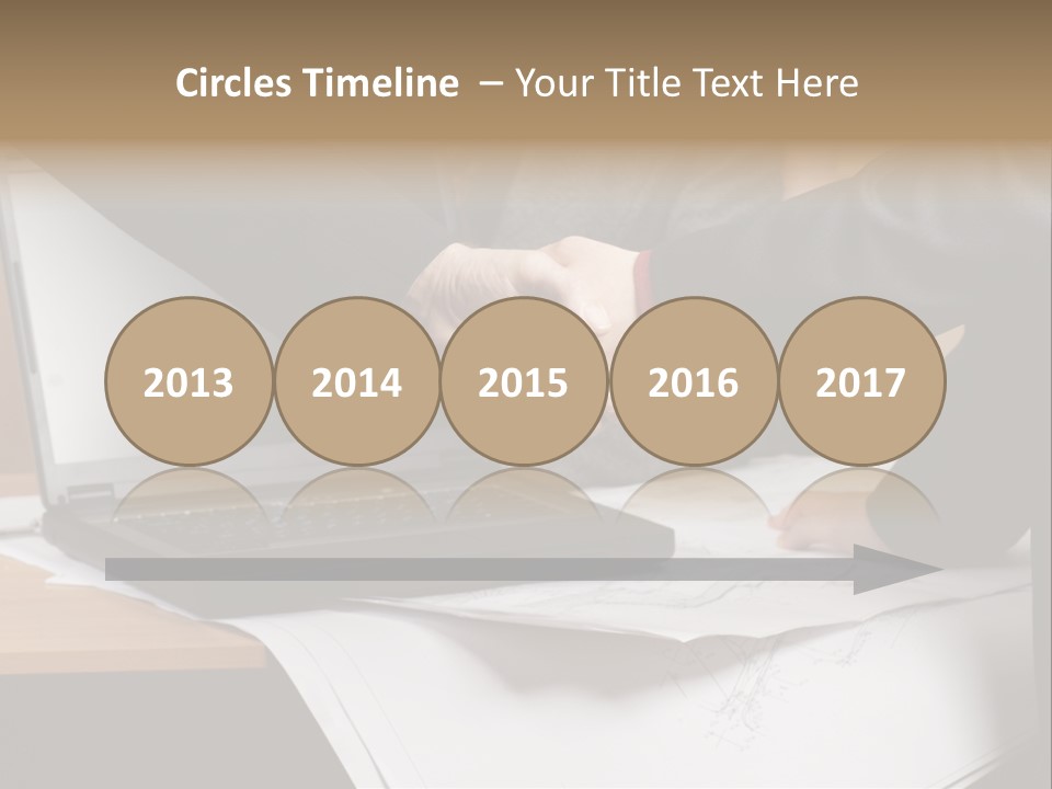 Two People Shaking Hands Over A Laptop Computer PowerPoint Template