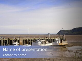 Low Tide In The Bay Of Fundy, Nova Scotia, Leaving Boats Completely Exposed Such As These Scallop Draggers. PowerPoint Template