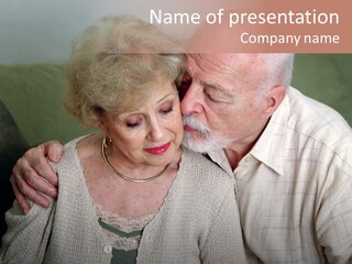 A Senior Man And Wife Deeply In Love. She Is Upset And He Is Comforting Her. PowerPoint Template