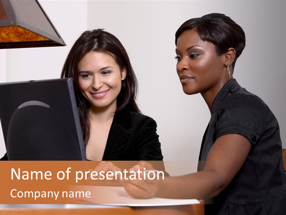 Two Women Working At The Computer PowerPoint Template