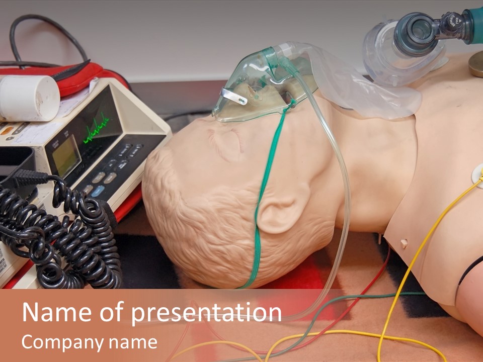 First-Aid Training Dummy With Respiratory Mask And Sensors Connected To Electrocardiograph Unit PowerPoint Template