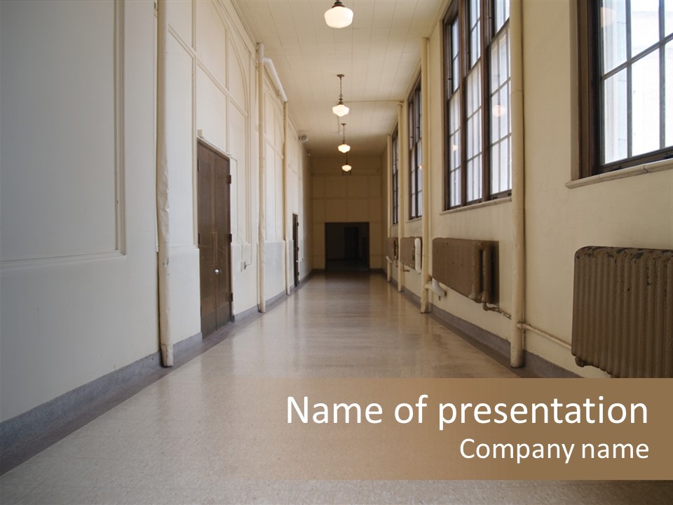 A Long Hallway In An Old High School PowerPoint Template